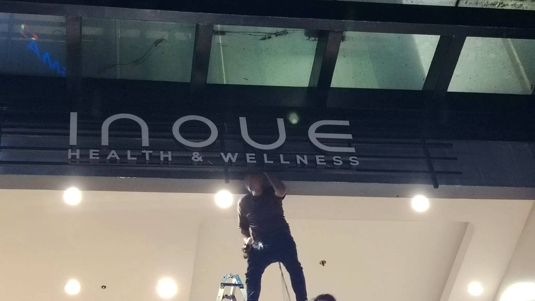 Inoue Health and Wellness sign unlit before repair