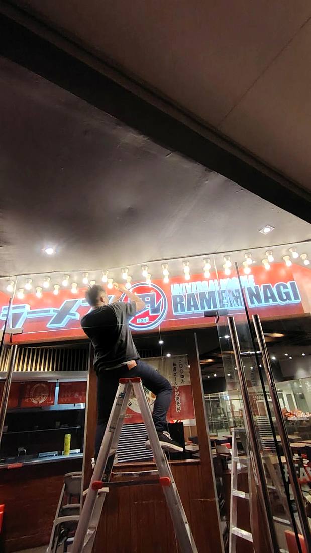 Ramen Nagi sign partially lit during LED repair